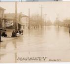 Water from the St. Marys River covered West Superior Street. (Photo courtesy of the Harter Postcard Collection/ACPL)