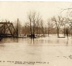 Entrance to the Main Street Bridge was cut off by high water from the St. Marys River. (Photo courtesy of the Harter Postcard Collection/ACPL)