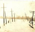This unidentified road disappeared under the St. Marys River floodwaters. (Photo courtesy of the Harter Postcard Collection/ACPL)