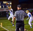 Homestead’s Seth Coate tip-toes into the end zone while official Mark Stultz makes sure he has both feet inbounds late in the second quarter Friday night against Carroll. (By Blake Sebring of The News-Sentinel)