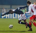 Poland's Euzebiusz Smolarek ,right, and DaMarcus Beasley of the United States fight for the ball during the friendly soccer match between Poland and U.S.A. in Plock, central Poland, Wednesday March 31, 2004.