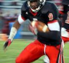 Bishop Luers' Jaylon Smith runs the ball in the first quarter of his teams 58-2&quot; win over Bishop Dwenger on Friday at Luersfield. Photo by By Don Converset of The News-Sentinel