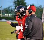 Bishop Luers interim coach Kyle Lindsay sends in an play with quarterback Noah Wezensky Friday night. (By Blake Sebring of The News-Sentinel)