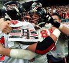 Bishop Luers players Brad Knipp and Adam Griffith embrace after the team's 38-6 victory against Danville in the 1999 Class 2A state finals at the RCA Dome in Indianapolis. The Bishop Luers defense held Danville, which entered the game ranked No. 1 in the state polls and averaging 41 points per game, to a season-low 118 total offensive yards as the Knights won their first state championship since 1992. (News-Sentinel file photo)