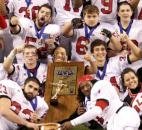 Bishop Luers celebrate with the state championship trophy after defeating North Putnam 26-14 in the 2010 Class 2A state finals at Lucas Oil Stadium in Indianapolis. Bishop Luers' defense forced two turnovers and returned a fumble for a touchdown as it beat North Putnam, which entered the game undefeated, for the school's second consecutive state title. (News-Sentinel file photo)
