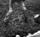 An unidentified boy strains to lift a sandbag at the Pemberton dike.