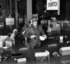 An employee of General Telephone checks out the flooded northeast division office at 525 Tecumseh Ave.