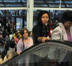 Lines of people pour through the Memorial Coliseum doors and up the escalator Tuesday morning before Aung San Suu Kyi’s address. By By Ellie Bogue