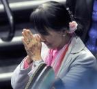 Nobel Peace Prize winner and world leader Aung San Suu Kyi bows her head in farewell Tuesday morning at Memorial Coliseum. By Ellie Bogue 