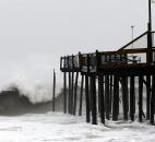 Part of the Ocean City Fishing Pier in Ocean City, Del., is damaged as Hurricane Sandy bears down on the East Coast, on Monday. 