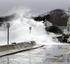 Heavy surf crashes over a seawall on the Atlantic Ocean during the early stages of Hurricane Sandy on Monday in Kennebunk, Maine. 