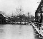 Onlookers on the Wells Street Bridge watched the rising floodwaters. (Photo courtesy of The History Center)