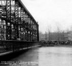 Crowds gathered on the eastern bank of the St. Marys River to observe the high water at the Main Street Bridge. (Photo courtesy of The History Center)