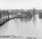 Looking from the Fort Wayne Saddlery Co., the bottom of the Spy Run Avenue Bridge nearly touched the St. Marys River. (Photo courtesy of The History Center)