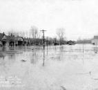 Residential porches and streets disappeared under water during the Flood of 1913. (Location unknown) (Photo courtesy of The History Center)