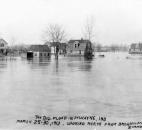 Looking north from the Broadway Bridge, now known as the Bluffton Road Bridge, floodwaters reached homes along Vesey Avenue. (Photo courtesy of The History Center)