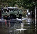 Members of the National Guard and Hoboken Police ride a large truck through floodwaters used to pluck people from high water in Hoboken, N.J., this morning, in the wake of superstorm Sandy. Parts of the city are still covered in standing water, trapping some residents in their homes. Photo by Craig Ruttle
