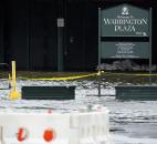 Water from the Hudson River rises at Warrington Plaza near the closed Hoboken train station on Monday. 