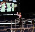 North Side drum major Kaelly Collins takes the center stand during the state marching band contest Saturday in Indianapolis. Drum majors Aye Min and Tim Clay shared duties for the Marching Redskins. Min, the only senior, said North Side "will rock it even harder next year." Photo by Garth Snow