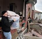 Peter Andrews removes belongings from his father's beachfront home, destroyed in the aftermath of a storm surge from superstorm Sandy, Tuesday, in Coney Island's Sea Gate community in New York.  Andrews, 4", who was born in the house, said "we had a lot of storms and the only damage in the past was when a national guardsman threw a sandbag through the window."  He added, the house was in the process of being sold. Photo by Bebeto Matthews