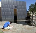 Shane Magness, a student at Oklahoma Christian University, bows his head in prayer for the victims of the Boston Marathon bombing Monday at the Oklahoma City National Memorial in Oklahoma City. On Friday, Oklahoma City will observe the 18th anniversary of the April 19, 1995, bombing of the Alfred P. Murrah Federal building that killed 168 people and injured hundreds more. Photo by By The Associated Press
