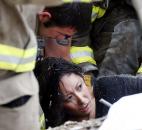 A woman is pulled out from under tornado debris at the Plaza Towers School in Moore, Okla., on Monday. (Photo by The Associated Press)