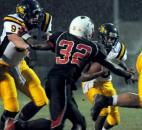 In the second quarter of Friday night’s game Snider’s Joshua Spitnale handle’s North Side’s Anthony Linnear for Snider’s Je’Norie Smith Friday night at North Side. Snider beat North side 17-6. (By Ellie Bogue of The News-Sentinel)