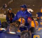 Homestead coach Chad Zolman, center, talks to his players after their 20-7 win over Norwell on Friday at Homestead. The Spartans clinched a share of the Northeast Hoosier Conference title. (By Reggie Hayes of The News-Sentinel)