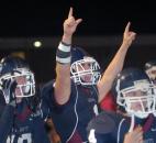 As the seconds tick off the clock Garrett’s Danny Stankovic and James Benson of Garrett begin to celebrate the 20-6 victory over Leo Friday night at Garrett. (By Ellie Bogue of The News-Sentinel)