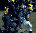 Snider’s defense brings down Homestead’s Frank Martin in the third quarter of the game . Snider beat Homestead Friday night 30-20. (By Ellie Bogue of The News-Sentinel)
