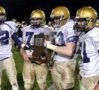 Bishop Dwenger accepts the Class 4A sectional championship trophy after the Saints'  &quot;4-7 win over Norwell on Friday at Norwell. From left, Ryan Watercutter, Shawn Ryan, Blake Bowers and Ben Evans. Photo by Reggie Hayes