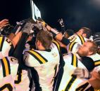 All the Snider football players were trying to touch the trophy they were awarded after winning the game Friday night against North Side, 24-14. Photo by Ellie Bogue of The News-Sentinel
