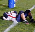 Heritage senior Tyler Chrisman takes a moment to grieve the end of his prep football career after the Patriots' 42-20 loss to Mishawaka Marian on Friday in the Class 3A regional at Mishawaka. Photo by Reggie Hayes