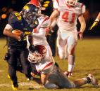 Snider Tyrell Swain runs the ball for a few yards in the fourth quarter Friday night. The beat Fishers in overtime by a two point conversion. Photo by Ellie Bogue