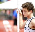 Jared Schipper of Bishop Dwenger waits as the judges align the bar in the pole vault event. (Photo by Gannon Burgett for The News-Sentinel)