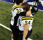 Snider's Alec Reuille, left, and Tyler Freimuth hug in the end zone after the Panthers' 39-&quot;4 loss to Lawrence Central in the Class 5A state finals. Photo by Rob Edwards