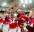 Wayne's Mike Lasley, Quavis Tate, Cornelius Bowick and Jeremy Messer hoist the state championship trophy after the team's 28-8 victory against Franklin County in the 1995 Class 4A state finals at the RCA Dome in Indianapolis. Sophomore Darnell LoVett scored three touchdowns, including a 50-yard interception return for a touchdown, to lead the Generals to their only state title in program history. (News-Sentinel file photo)