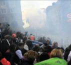 In this image from video provided by Ryan Hoyme, the second explosion can be seen in the distance as smoke from the first explosion surrounds spectators exiting the stands during the Boston Marathon in Boston on Monday Photo by By The Associated Press