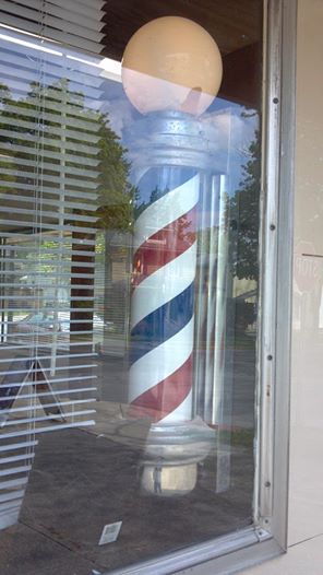 Barber's pole in window